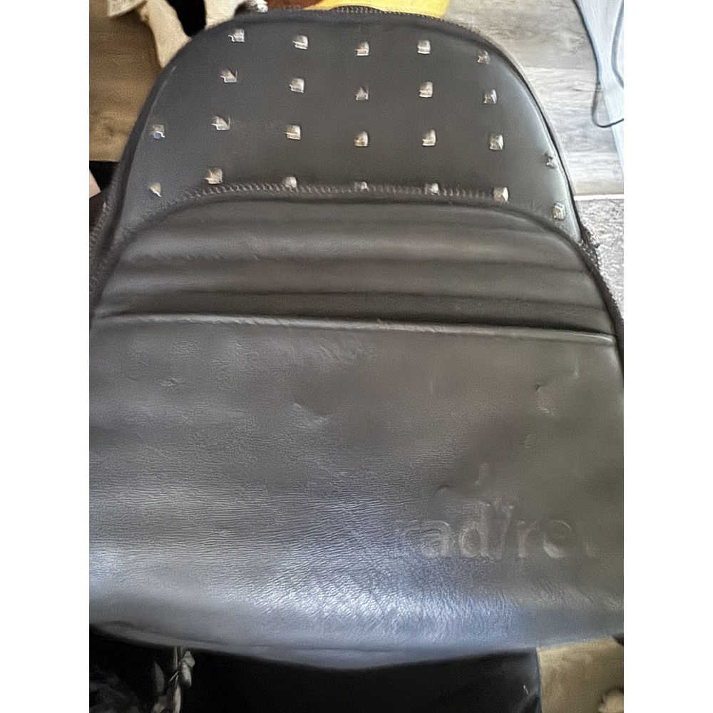 Rad Rev The 1 mini backpack in a matte black finish gunmetal studs PT5 read